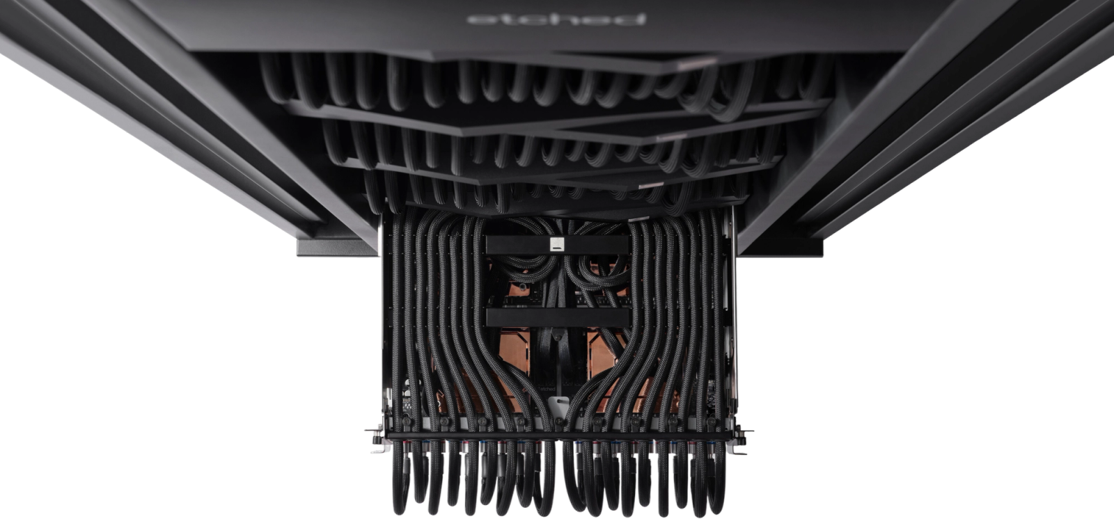 Interior of an Etched liquid-cooled inference rack showing dense cabling and compute trays